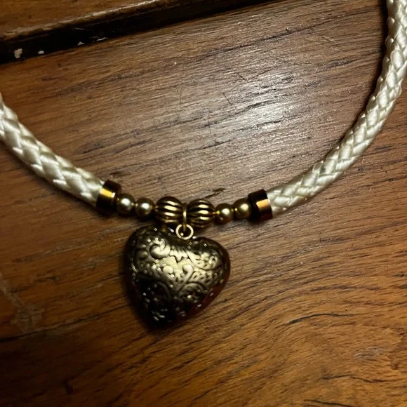 Choker with a white rope and gold dangling heart with gold hardware. - Picture 2 of 4